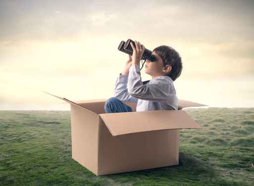 Young explorer using binoculars