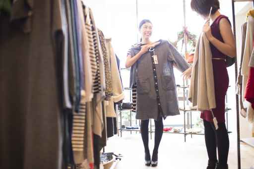 Women are choosing clothes with friends