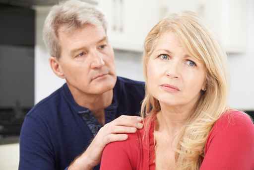 Mature Man Comforting Woman With Depression