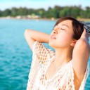 Asian young beautiful woman relaxing in the beach