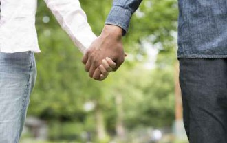 Couple taking a walk hand in hand in the park