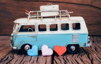 Hearts with blue van background on old wooden table.